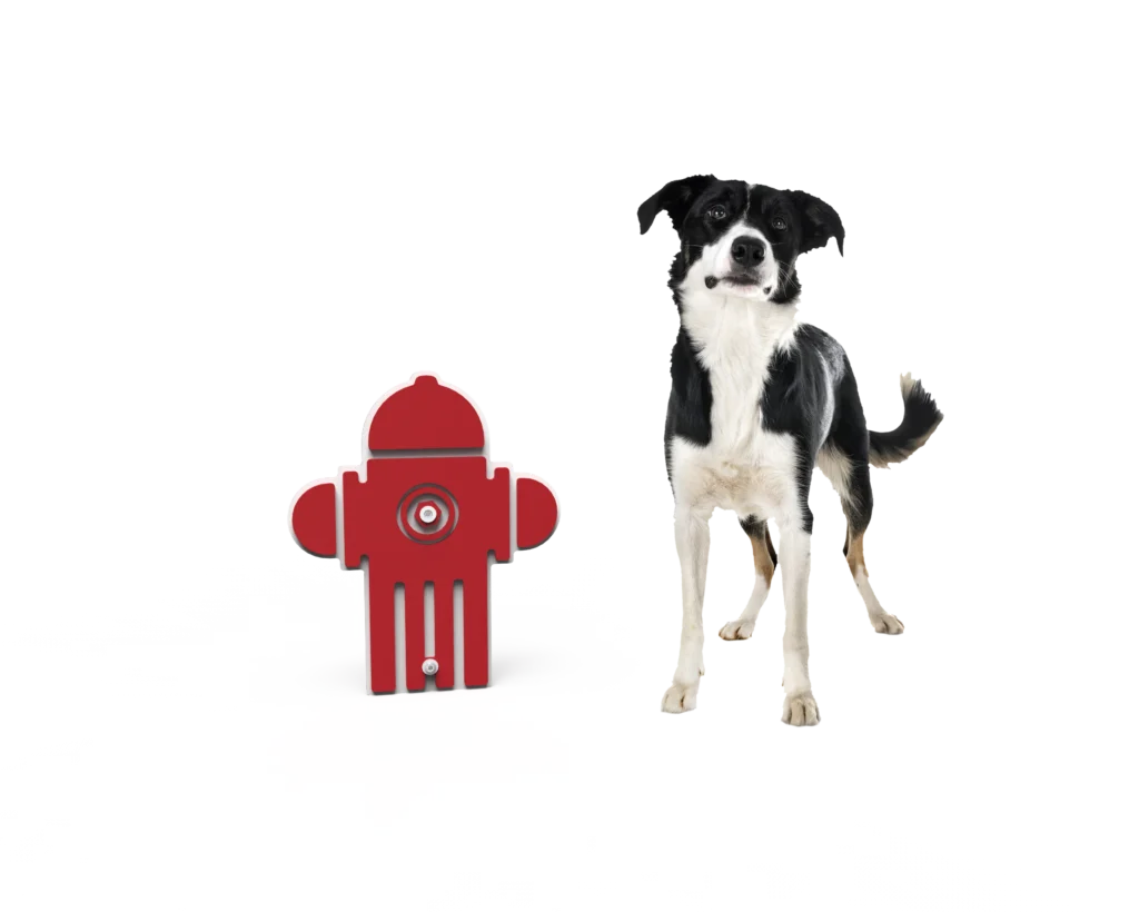 picture of fake fire hydrant and dog standing next to it
