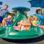 Group of children on green ten spin