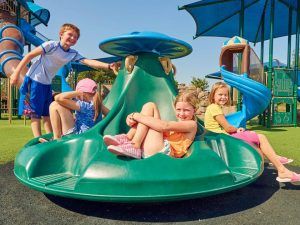 Group of children on green ten spin