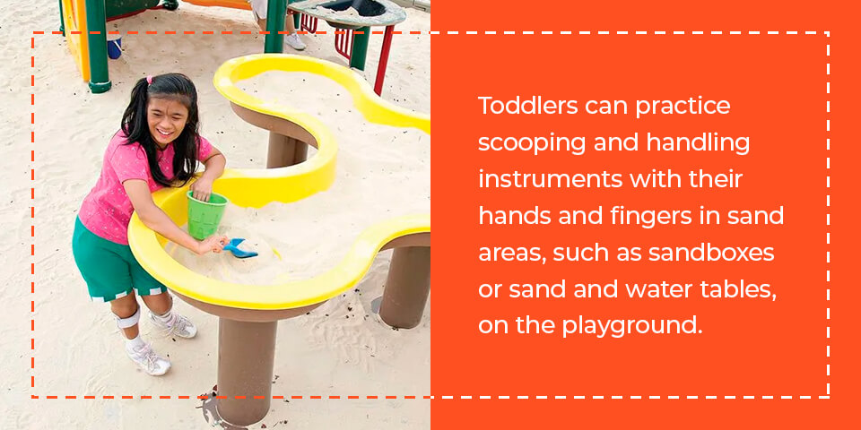 Toddlers can practice scooping and handling instruments with their hands and fingers in sandboxes.