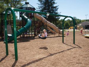 Commercial playground swing set in park